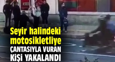 Seyir halindeki motosikletliye çantasıyla vuran kişi yakalandı