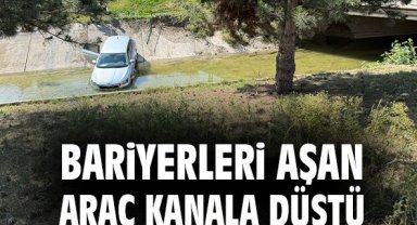 Bariyerleri aşan araç kanala düştü